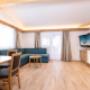 Wohnzimmer und Küche - Appartement Alpentraum