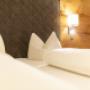 Bett - Zimmer Bergblick Bett - Zimmer Bergblick