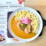 Gefüllte Fleischroulade mit Fusilli und würziger Rahmsauce, verfeinert mit Preiselbeernote – deftiges Wirtshausgericht im Brandauer Bierbögen Wien, hausgemacht und aromatisch.