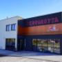 Asia Restaurant Terrakotta – moderne Außenansicht bei Tag mit Parkplatz und stilvollem Eingangsbereich in 2542 Kottingbrunn.