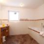 Badewanne und Regendusche im Appartement Steiner in Leogang im Salzburgerland