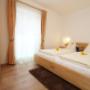 Schlafzimmer im 65m² Familien-Appartement Steiner in Leogang im Salzburgerland