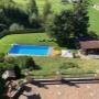 Gartenanlage und beheizter Pool im Romantik Aparthotel Sonnleitn