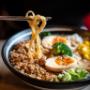 "Frische Spicy Tantan Ramen im Kibo Wien. Authentische Nudelsuppe mit pikanter Note. Genieße die beste Ramen Wien Qualität direkt vor Ort oder per Lieferservice."