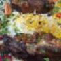 Saftiger Lamm Teller mit aromatischem Basmatireis, Rosinen, frischen Kräutern und knackigem Salat im Babylon 1030 am Rennweg. Authentisches orientalisches Essen und traditionelle irakische Küche mit orientalischem Flair in Wien 1030.