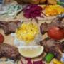 Holzkohlengrill Spezialitäten im Babylon 1030: Saftige Lammspieße, Schaschlik orientalisch und zartes Grillfleisch mit Reis, Taboulé Salat und frischen Beilagen. Authentisches arabisches Restaurant für orientalisches Essen in 1030 Wien am Rennweg.
