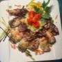 Frisch zubereitete Balkan Fischgerichte im Kinng Grill in Wien – genießen Sie gegrillte Calamari als Teil unserer authentischen Balkanküche vom Holzkohlegrill.